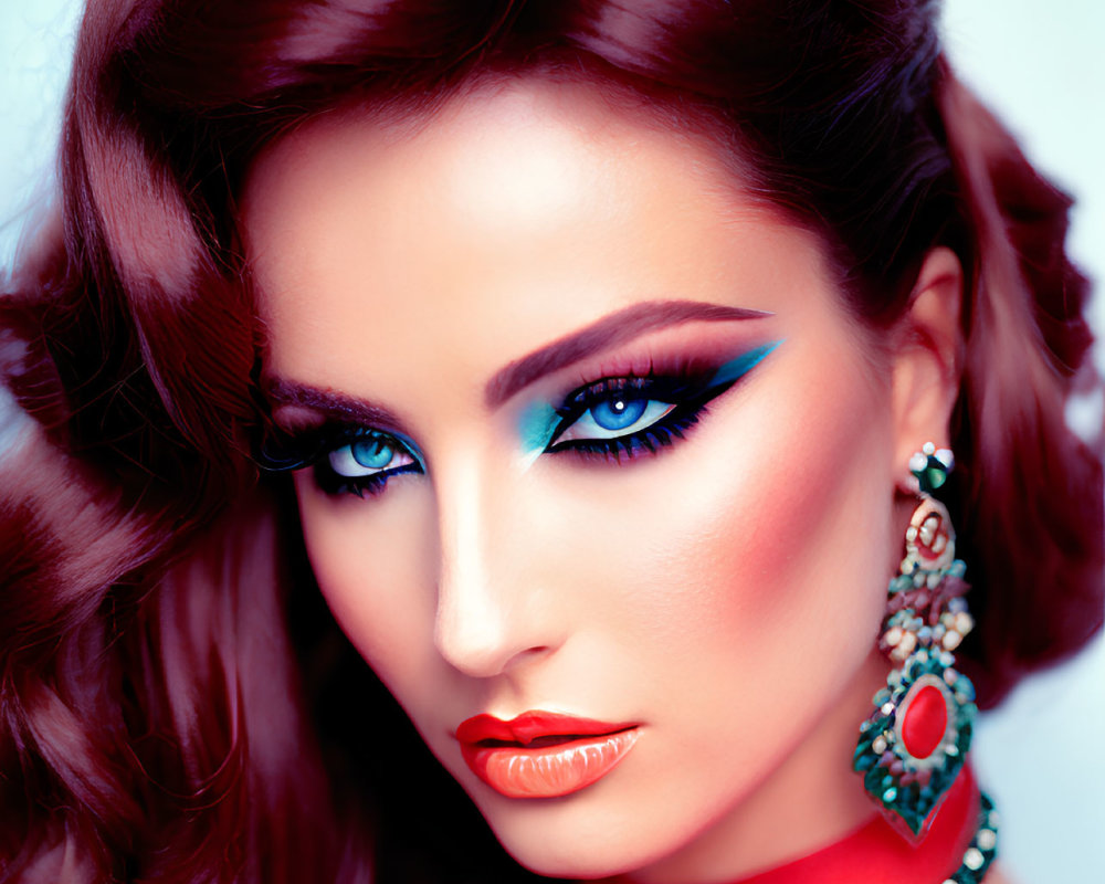 Woman with Vivid Blue Eyes and Dramatic Makeup in Red Outfit