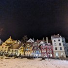 Quaint Village Covered in Snow at Night