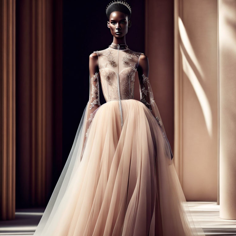 Elegant model in sheer bodice gown with tulle skirt and crown against soft-lit backdrop