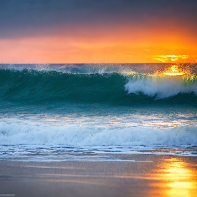 Vibrant orange sunset over ocean with turquoise wave on sandy beach