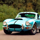 Blue Sports Car with White Stripes and Chrome Details Parked on Road