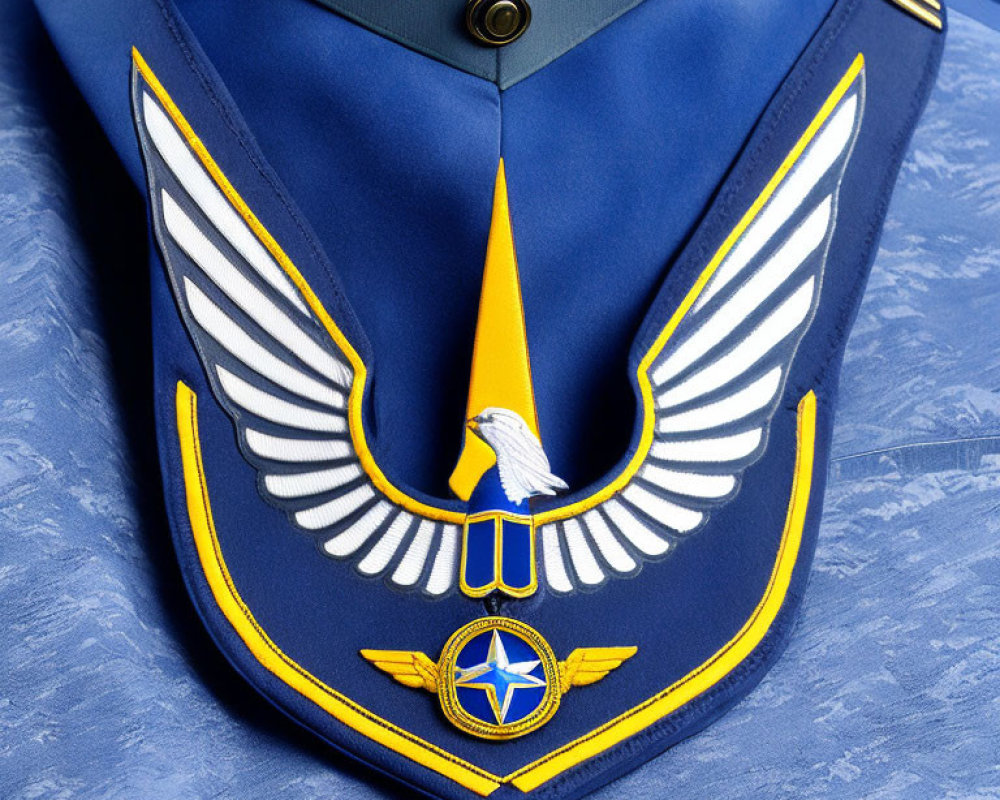 Detailed close-up of blue military uniform with golden eagle insignia and rank epaulettes