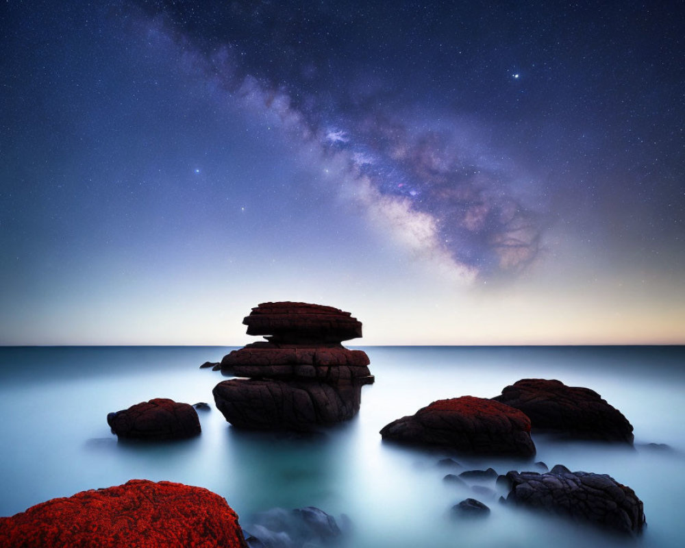 Tranquil Nightscape: Milky Way over Misty Waters & Moss-Covered Rocks