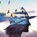 Surreal female figure with transparent head filled with landscape and birds in mystical backdrop