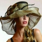 Elaborate Hat Portrait with Swirl Patterns and Golden Tones