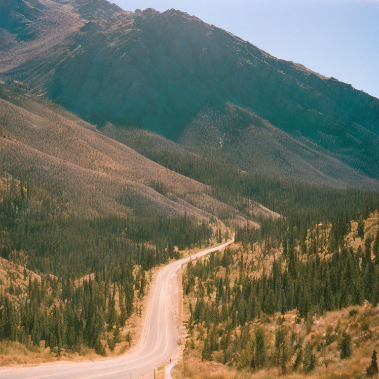 Scenic winding road through mountainous landscape