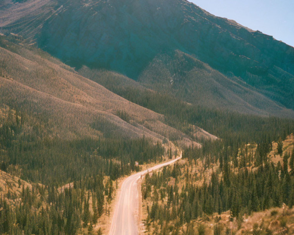 Scenic winding road through mountainous landscape