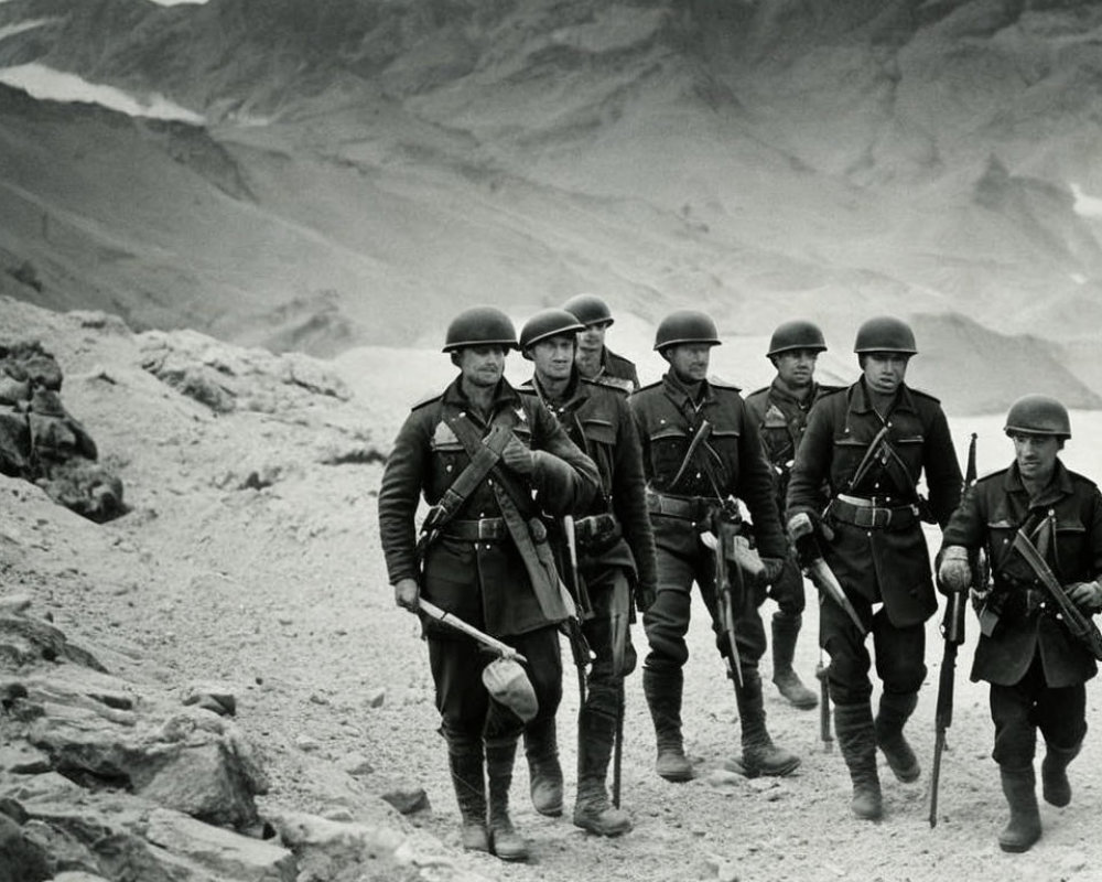 Vintage soldiers marching in rocky terrain with mountains.