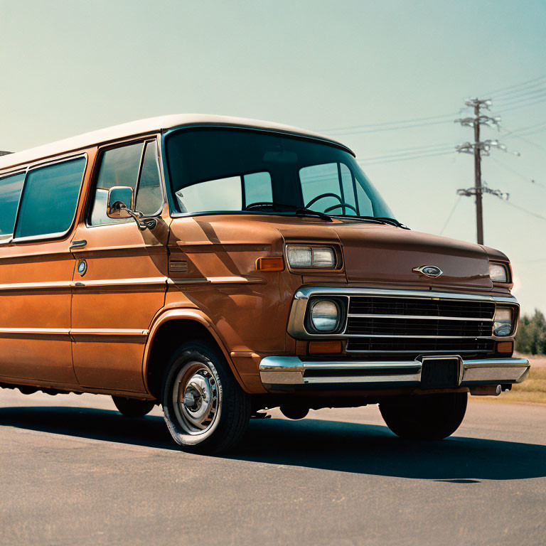 Classic Brown Ford Van Parked on Road with Clear Skies and Utility Poles