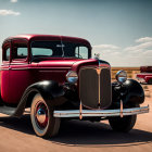 Vintage Red Pickup Truck Parked on Sandy Plain with Classic Vehicle in Background