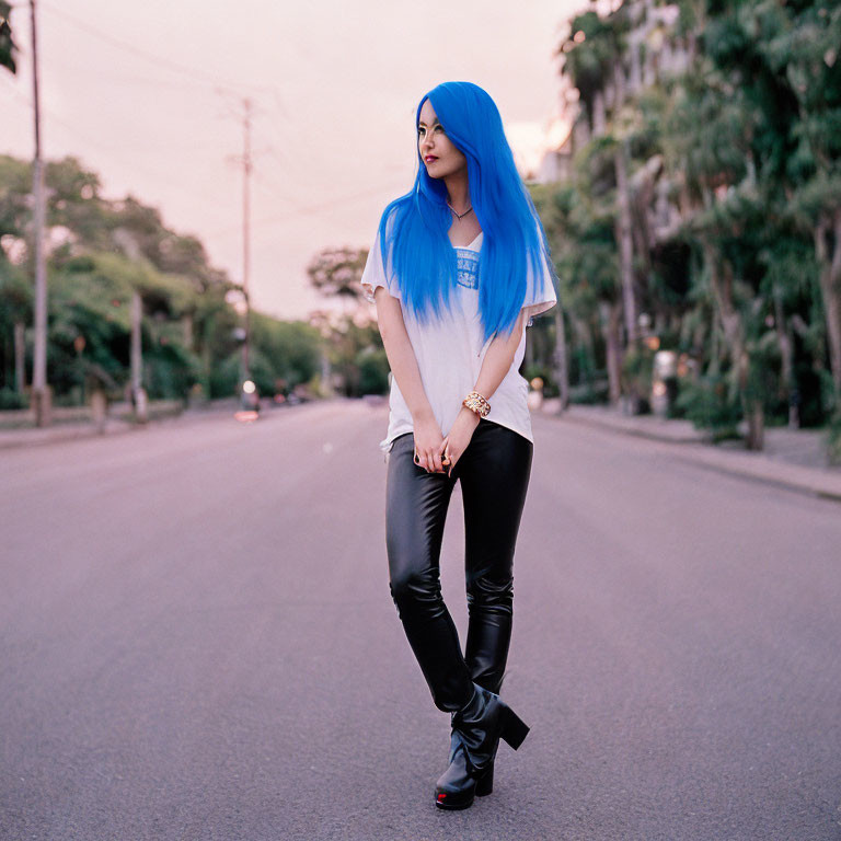 Woman with Vibrant Blue Hair in Empty Twilight Street