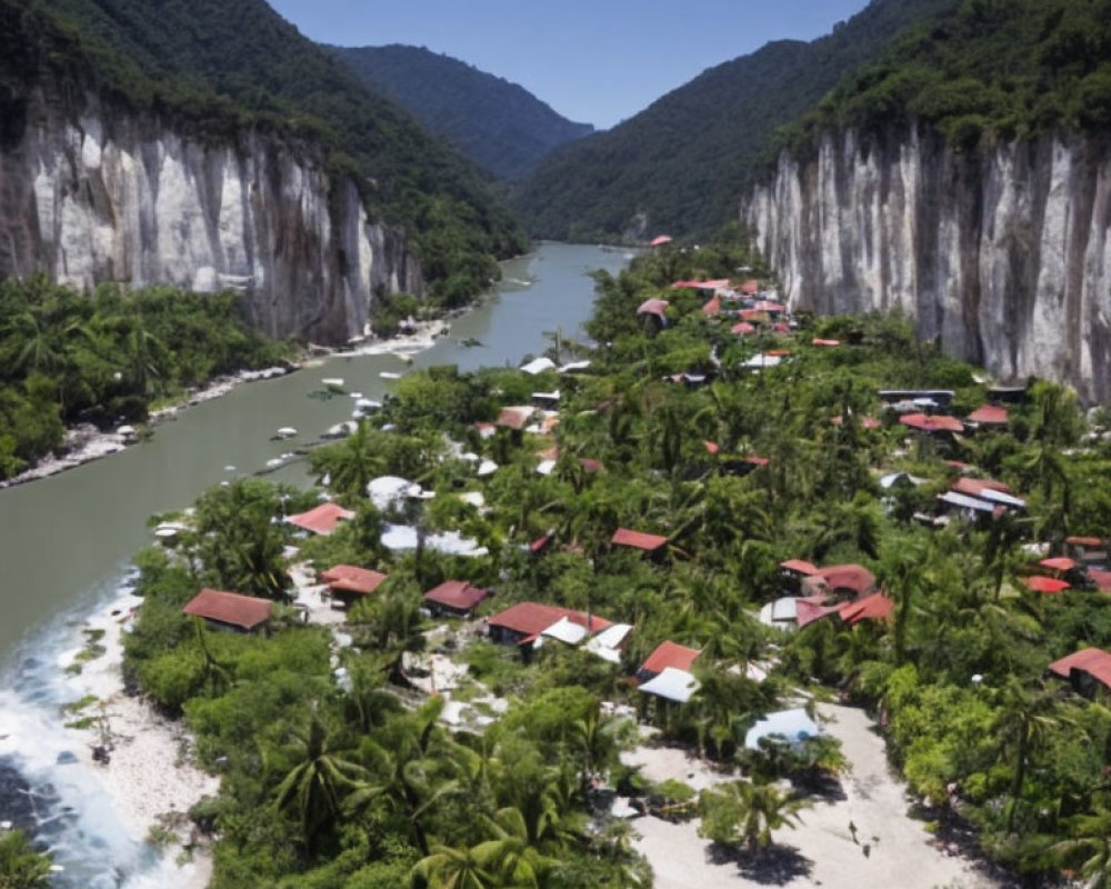 Tropical village surrounded by river, hills, and white cliffs