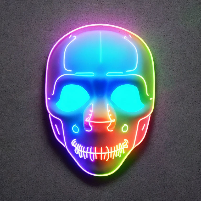 Vibrant neon skull sign with purple, green, and yellow gradient on gray wall