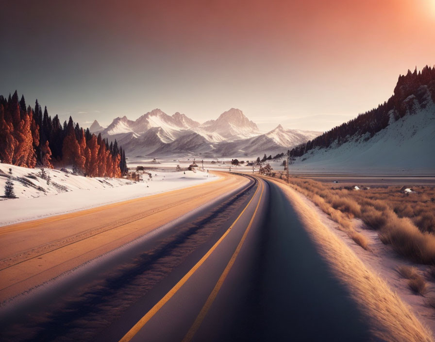 Scenic snowy landscape with winding road and sunset glow