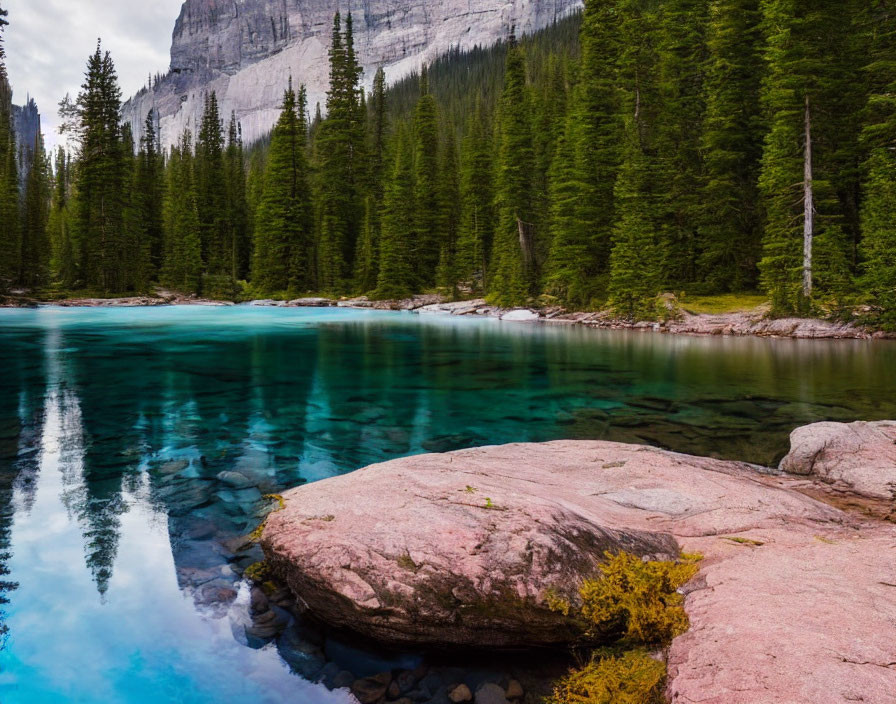 Tranquil Turquoise Lake with Rocky Shore and Pine Trees