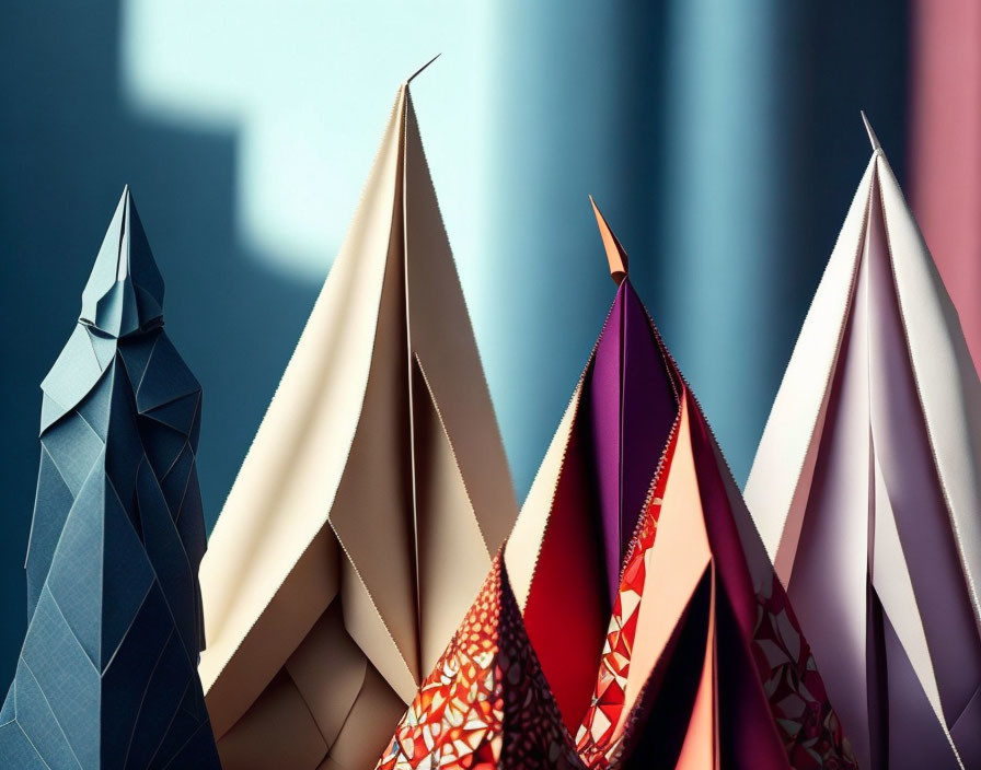 Vibrant paper folds create abstract mountain shapes on soft background