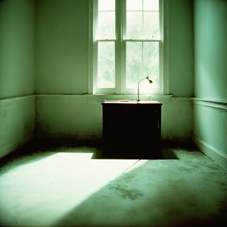 Desk and lamp in room with window light and shadow