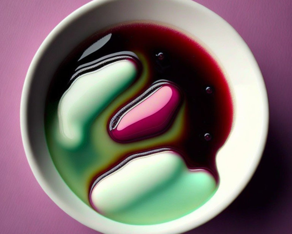 Abstract White Bowl with Purple, Black, and Green Swirls on Purple Background