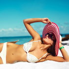 Woman in White Bikini and Red Sunhat Relaxing on Sunny Beach