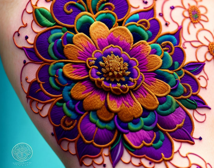 Colorful embroidered flower on fabric with intricate patterns and textures