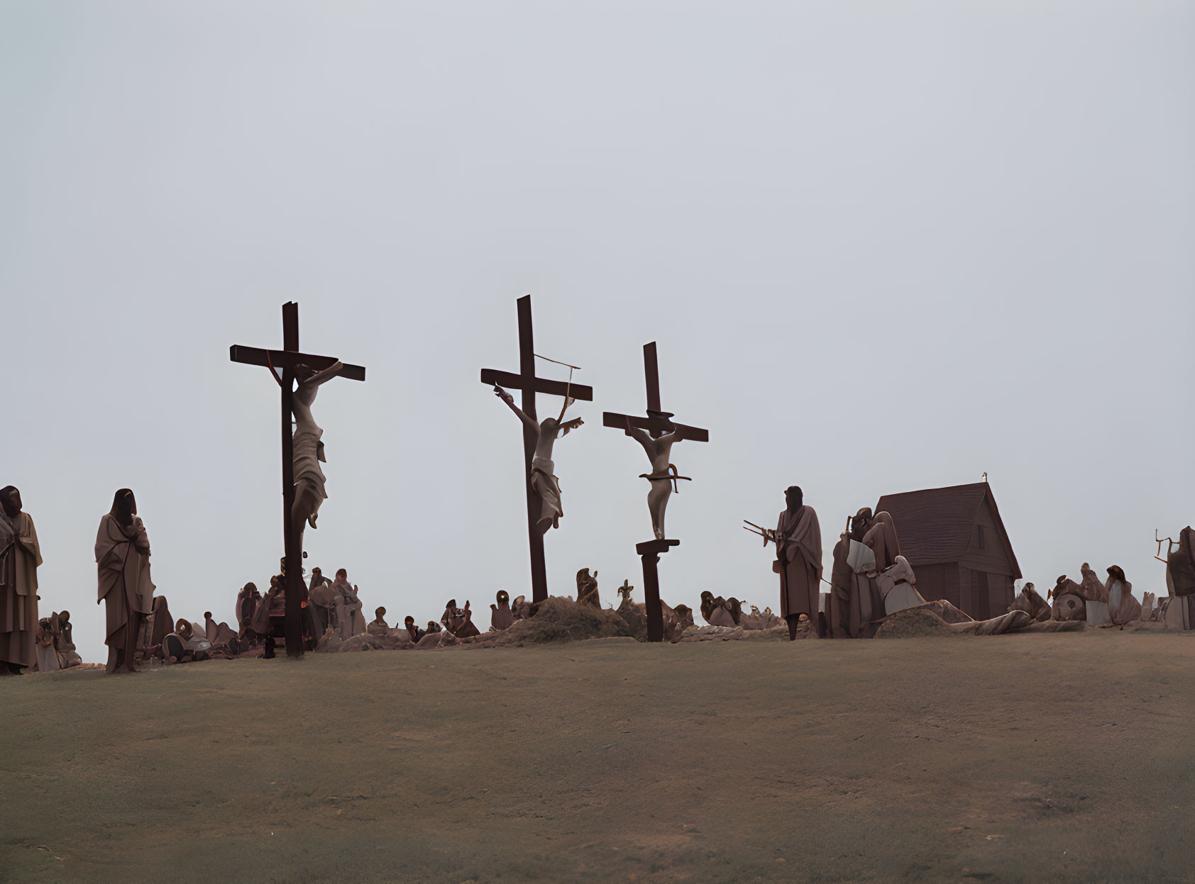 Scene of three individuals crucified on a hill with onlookers - solemn atmosphere