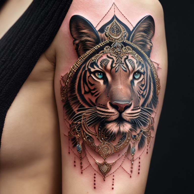 Detailed Tiger Face Tattoo with Jewelry on Arm Against Black Background