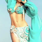 Ornate belly dance costume with turquoise and gold embellishments