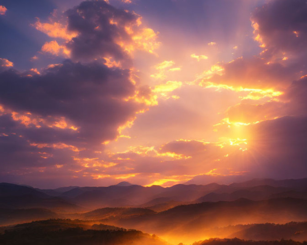 Majestic sunrise with golden rays over misty mountain landscape