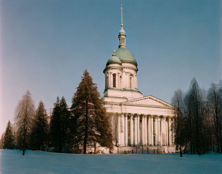 Neoclassical Cathedral with Dome and Columns in Snowy Twilight Landscape