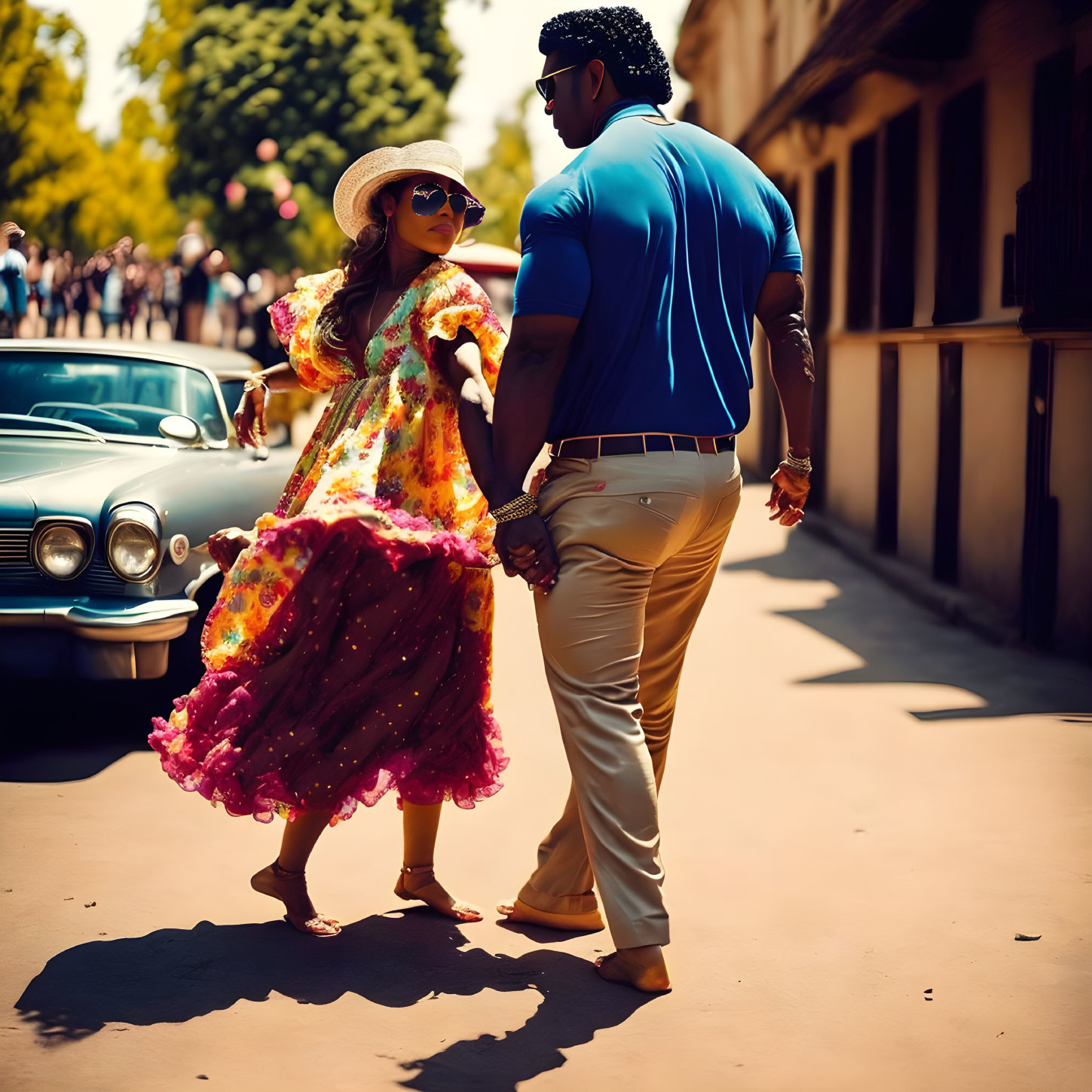 Fashionable couple in colorful attire walking by vintage car