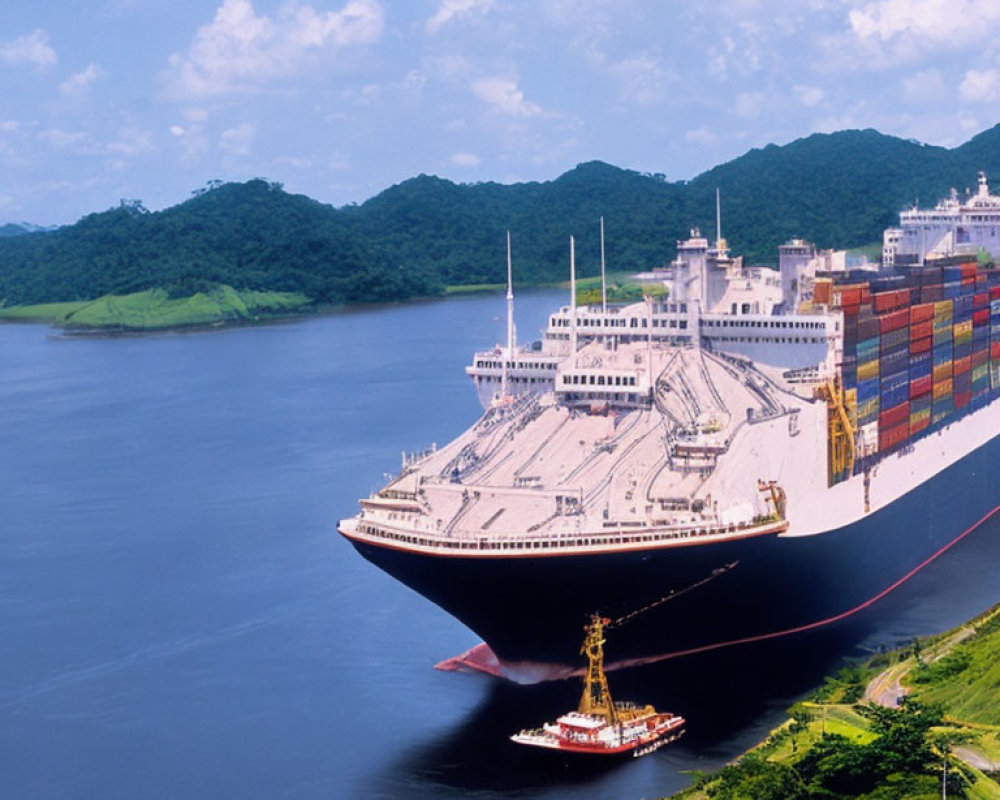 Cargo ship with containers sailing between green hills on waterway