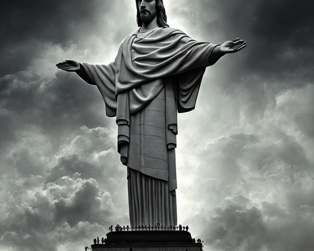 Giant Christ the Redeemer statue under cloudy sky