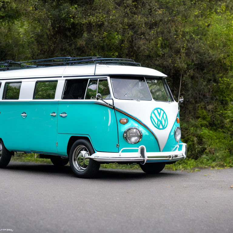 Vintage turquoise and white Volkswagen Type 2 bus on forest road