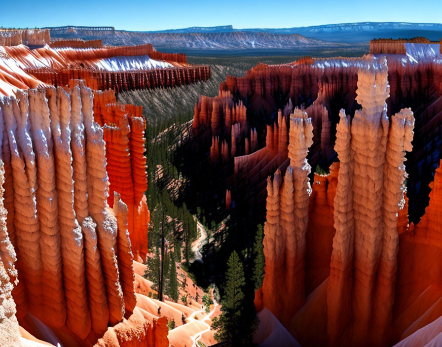 Vibrant orange rock formations in canyon under blue skies