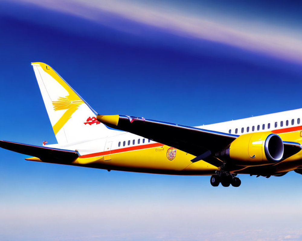 Yellow and white commercial airplane with sun logo flying high in clear skies