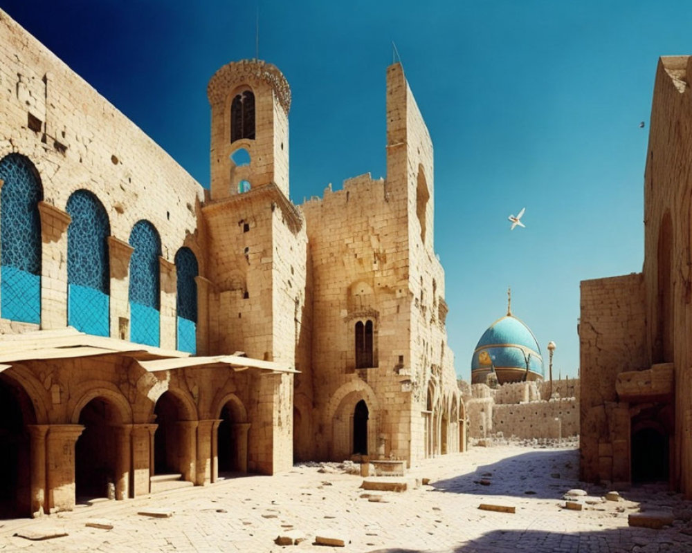 Ancient stone architecture with arched doorways, tower, and dome under clear blue sky