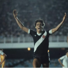 Athlete in Black and White Uniform Celebrates Victory on Sports Field