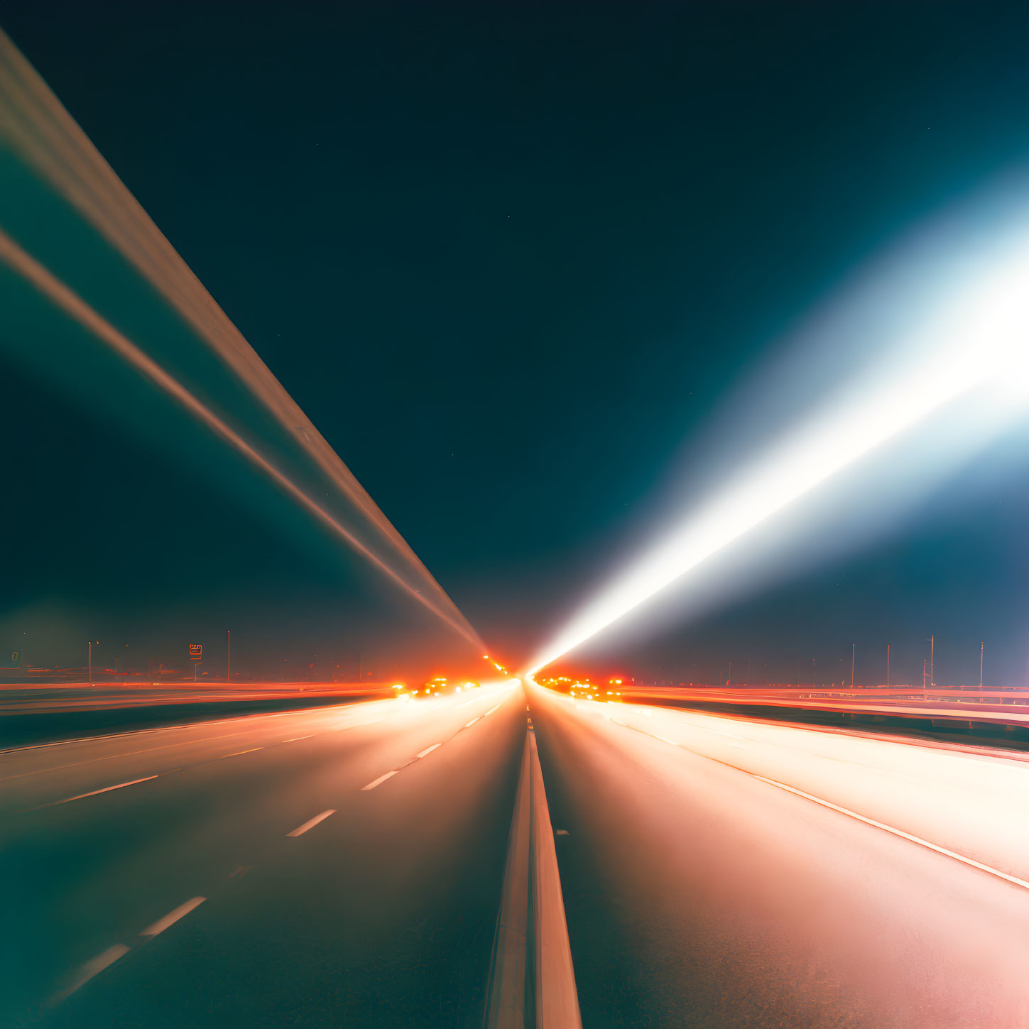 Highway night scene with vehicle light trails in long-exposure shot