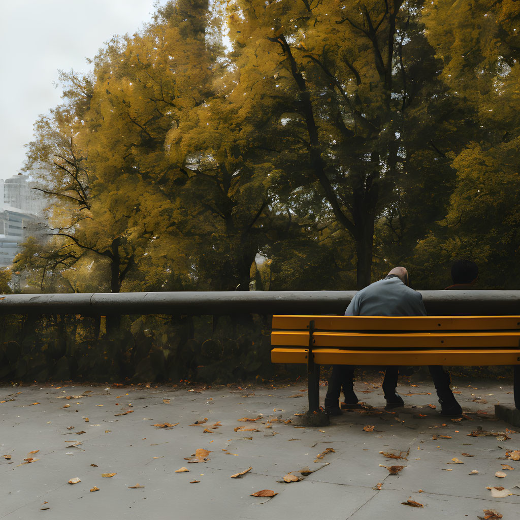 Autumn Park Scene: Two People on Yellow Bench Amid Yellow Trees