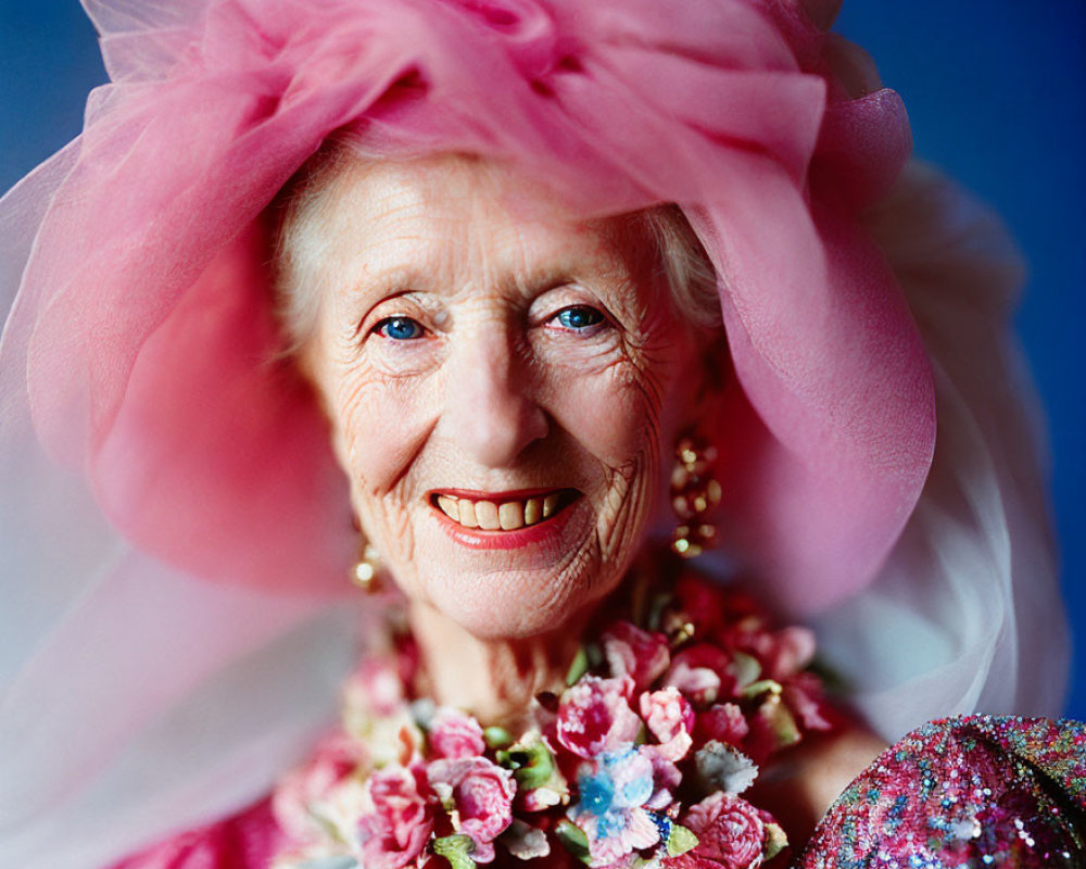 Elderly Lady in Pink Hat with Tulle and Floral Adornments