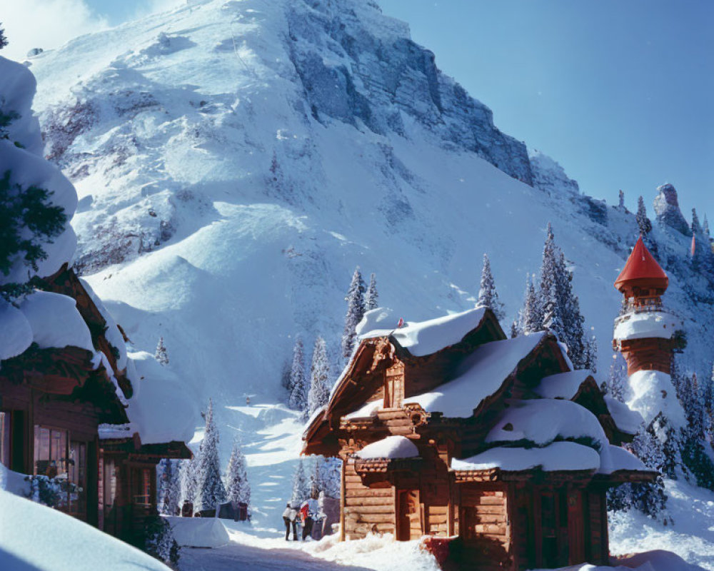 Scenic Alpine village with chalet-style buildings and mountain peak on clear day