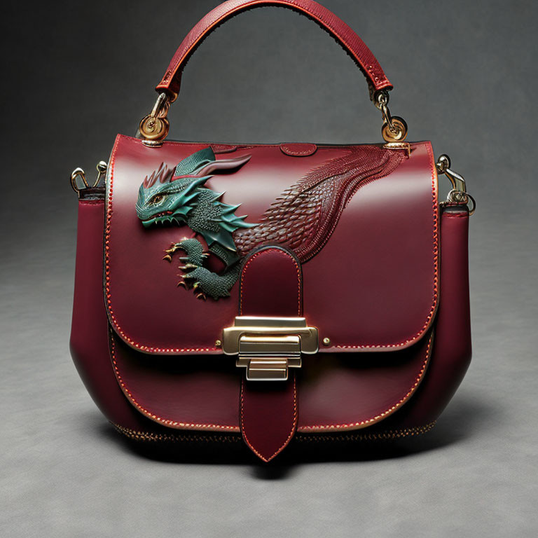 Burgundy Designer Handbag with Gold Clasp & Green Dragon Motif