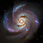 Spiraling Galaxy with Pink Star-Forming Regions and Brilliant Stars