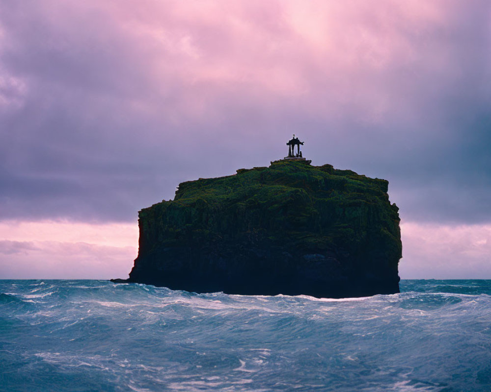 Camera on Tripod Capturing Isolated Sea Stack at Dusk