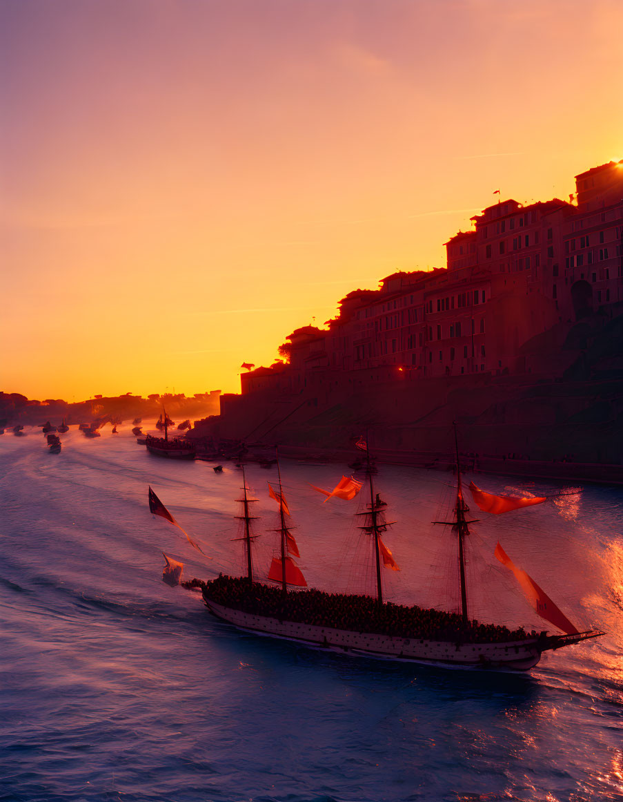 Historic sailing ship on river at sunset with ornate buildings