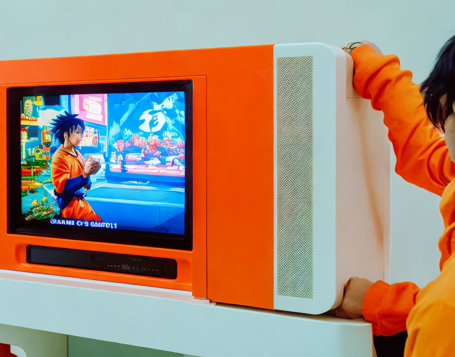 Person in Orange Top Adjusts Retro TV with Animated Character