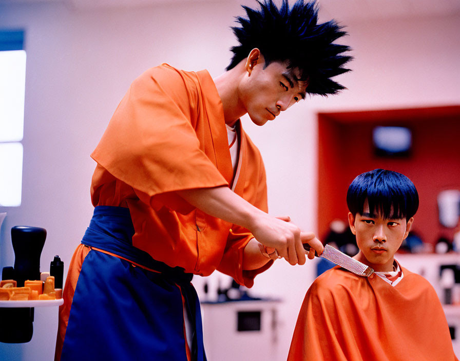 Hairstylist cutting young boy's hair in salon with spiky hair and tools