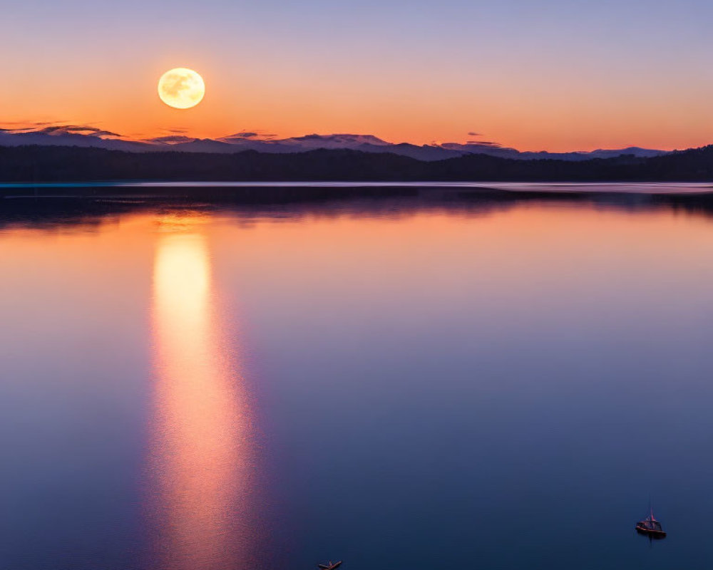 Tranquil full moon reflected on calm lake with silhouetted boats