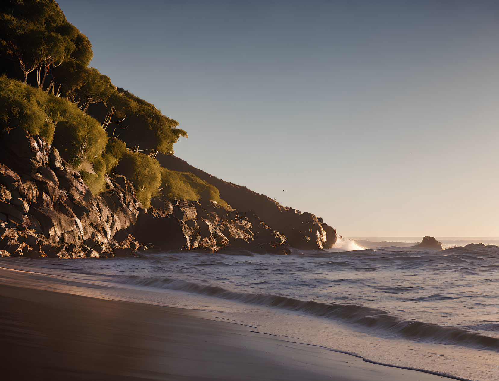 Tranquil Beach Scene with Waves, Sunlight, and Cliffs