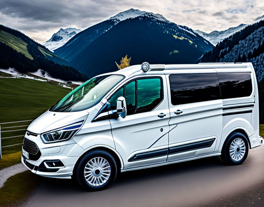 White modern van parked in scenic mountain landscape